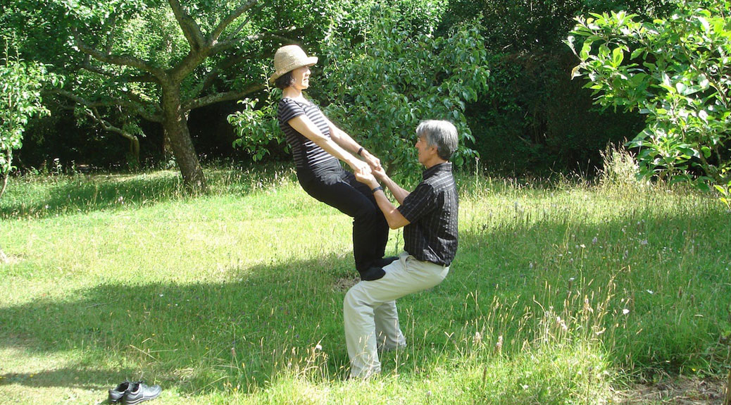 Photograph of Peter Ribeaux using the Alexander Technique to balance and counterbalance with visiting AT teacher