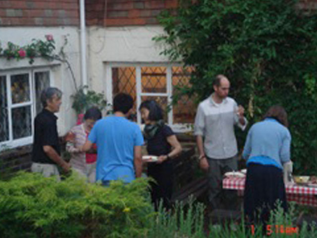 Photograph of students and teachers from Centre for the Alexander Technique having a barbecue in Sussex